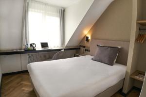 Postel nebo postele na pokoji v ubytování Alp de Veenen Hotel