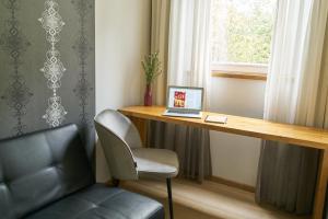 Posezení v ubytování Alp de Veenen Hotel