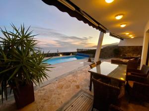 a view of a pool from a house at Seafront Puerto Calero Villa in Puerto Calero