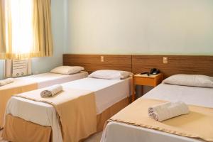 Postel nebo postele na pokoji v ubytování Pompeu Rio Hotel