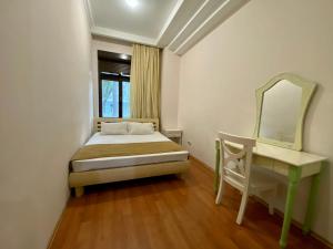 Posteľ alebo postele v izbe v ubytovaní Old City Apartment