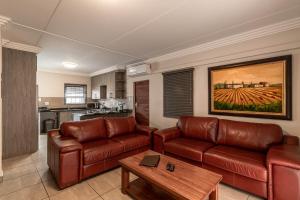 Imagen de la galería de Camelot Guest House & Apartments, en Potchefstroom