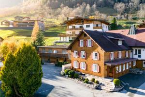 an aerial view of a house in a village at Appartement Walserstuba by A-Appartments in Brand +18 photos