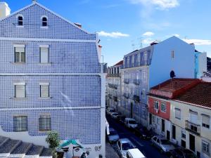 a view of a city street with buildings at Mouraria lovers cozy bright apartment in Lisbon