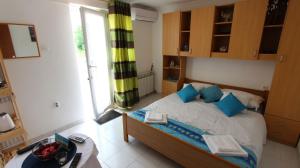 Łóżko lub łóżka w pokoju w obiekcie Apartment Kreslin