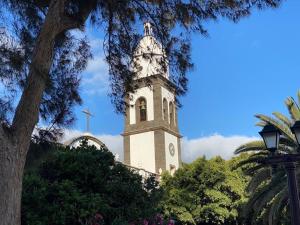 a clock tower on top of a building at LANZAROTE VACACIONAL in Arrecife