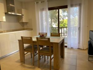 a kitchen with a table and chairs and a window at LANZAROTE VACACIONAL in Arrecife