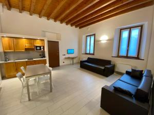 a living room with a couch and a table at Cascina San Giovanni in Arcore