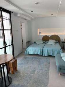 En eller flere senge i et værelse på Aparthotel El Cargol