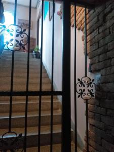 a stairway with a wrought iron gate with stairs at Bolonja 1 in Užice
