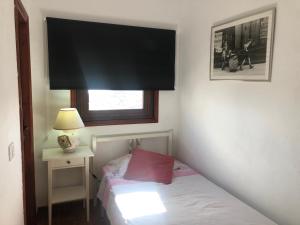 Ένα ή περισσότερα κρεβάτια σε δωμάτιο στο CASA ABUELA MINA +10 φωτογραφίες