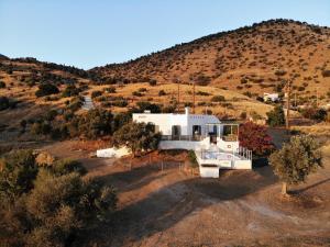 an aerial view of a house in the middle of a hill at Serendipity Crete in Agia Galini