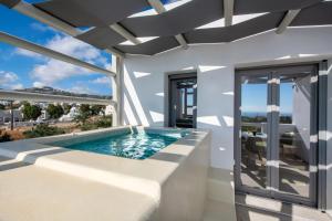 a swimming pool in a villa with a view at Thiramor houses in Mesaria