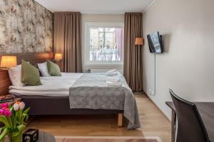 Postel nebo postele na pokoji v ubytování SPiS Hotell Naran
