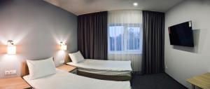 Ένα ή περισσότερα κρεβάτια σε δωμάτιο στο Park Hotel