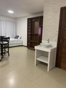 Giường trong phòng chung tại Pousada Brisas do Vale +8 ảnh