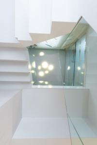 a mirror on the wall of a building at Hotel Boreal Viento Norte in Burgos