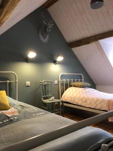 Giường trong phòng chung tại Gîte Les Carelles