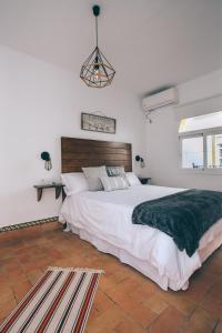 A bed or beds in a room at Alcázar de María