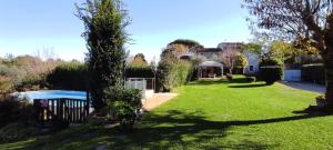a view of a yard with a gazebo at Casa del Merlo in SantʼAndrea di Compito