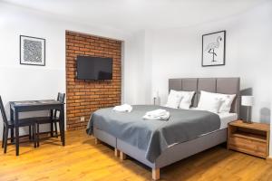 Posteľ alebo postele v izbe v ubytovaní Apartamenty, Boutique Rooms Villa 82, MIEJSCE PRKINGOWE