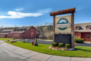 a sign in front of a building on a street at Cabins at Grand Mountain in Branson