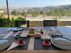 a table with a bunch of food on it at YASTIK HOUSES - Cappadocia in Goreme