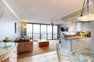 a kitchen and living room with a view of the ocean at Sea Colony - 502 Annapolis House in Bethany Beach