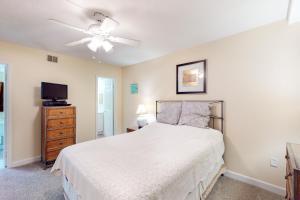 a bedroom with a bed and a ceiling fan at Sea Colony - 502 Annapolis House in Bethany Beach +38 photos