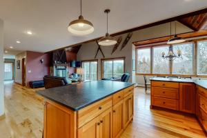 a kitchen with a large island in a room at Thunder Ridge Lodge in Newry