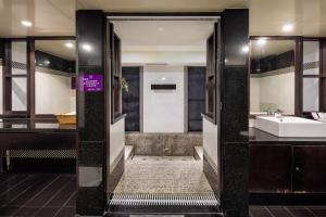 a bathroom with a sink and a tub and a toilet at Discovery Motel - Nangang臺北市旅館349-2號 in Taipei +54 photos