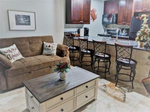 a living room with a couch and a table at Gulf View, Flip Flop Oasis GVR06432 in Galveston