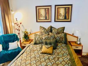 a bedroom with a bed with pillows on it at apartament Durau in Durau