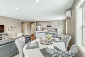 a kitchen and living room with a table and chairs at Liberty Bay Loft in Poulsbo