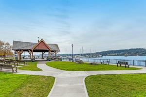 a park with benches and a gazebo near the water at Liberty Bay Loft in Poulsbo