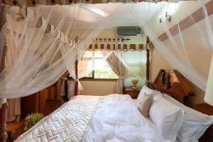Postel nebo postele na pokoji v ubytování Oceane Self Catering