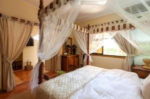 Postel nebo postele na pokoji v ubytování Oceane Self Catering