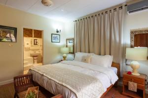 Postel nebo postele na pokoji v ubytování Oceane Self Catering