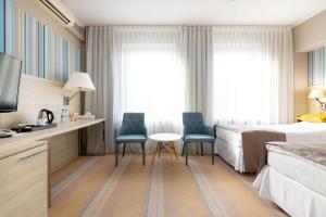 Posteľ alebo postele v izbe v ubytovaní Hotel Cristal Białystok