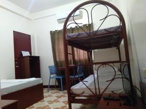 מיטה או מיטות קומותיים בחדר ב-Watermoon Beach Resort