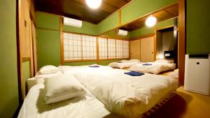 Katil atau katil-katil dalam bilik di 湊庵錆御納戸-so-an sabionand-