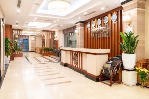 a lobby of a hospital with a reception desk at Hanoi Larosa Hotel in Hanoi