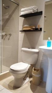 a bathroom with a toilet and a sink at Casa Prada Bed & Breakfast in Bogotá