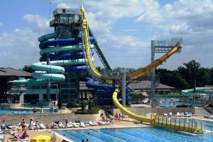 a water slide in a water park with a pool at Garni Hotel Villa Tamara in Moravske-Toplice