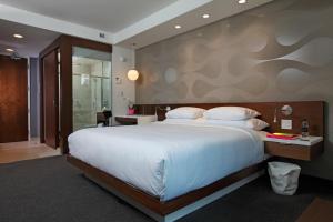 Postel nebo postele na pokoji v ubytování Mere Hotel