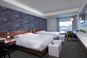 Postel nebo postele na pokoji v ubytování Mere Hotel
