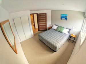 an overhead view of a bedroom with a bed at Aspiring Apartment Wanaka in Wanaka
