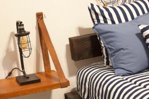 a bedroom with a bed and a lamp on a table at Aquamarina in La Paz