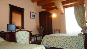 TV o dispositivi per l'intrattenimento presso Hotel Archimede Ortigia