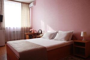 Voodi või voodid majutusasutuse Gostinichnyi Kompleks Lada-Voskhod toas